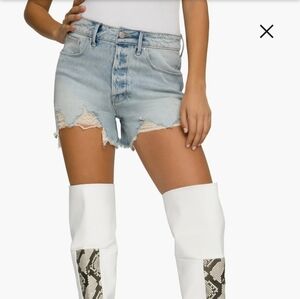 Good American Light Blue Distressed Denim Bombshell Shorts.